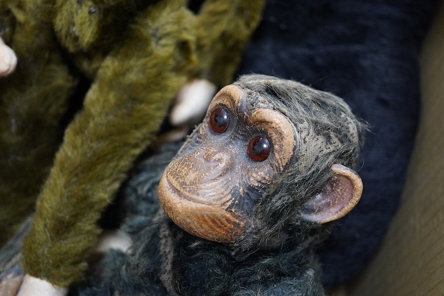 A Farnell’s Alpha Toys monkey, seven other soft toy monkeys and a soft toy rabbit, Farnell 36cm. Condition varies